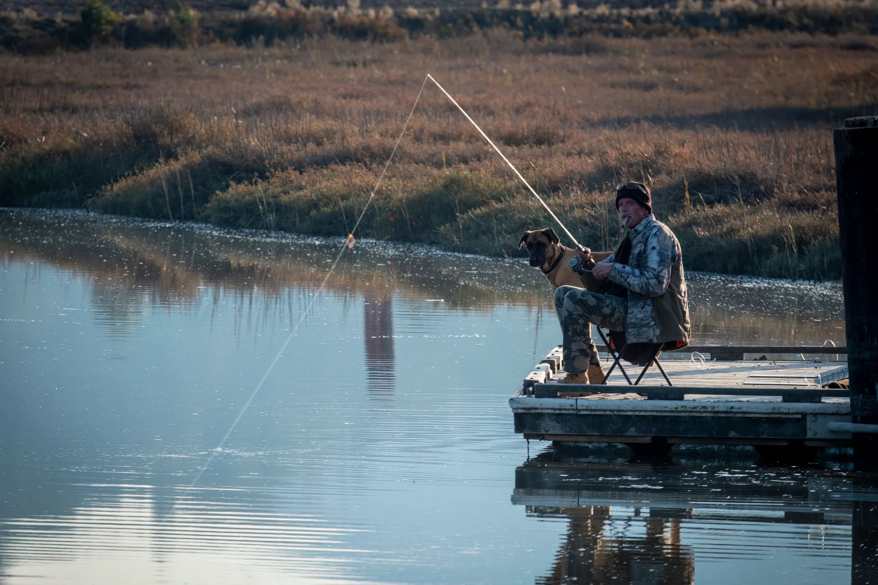 Real fisherman on a quiet lake